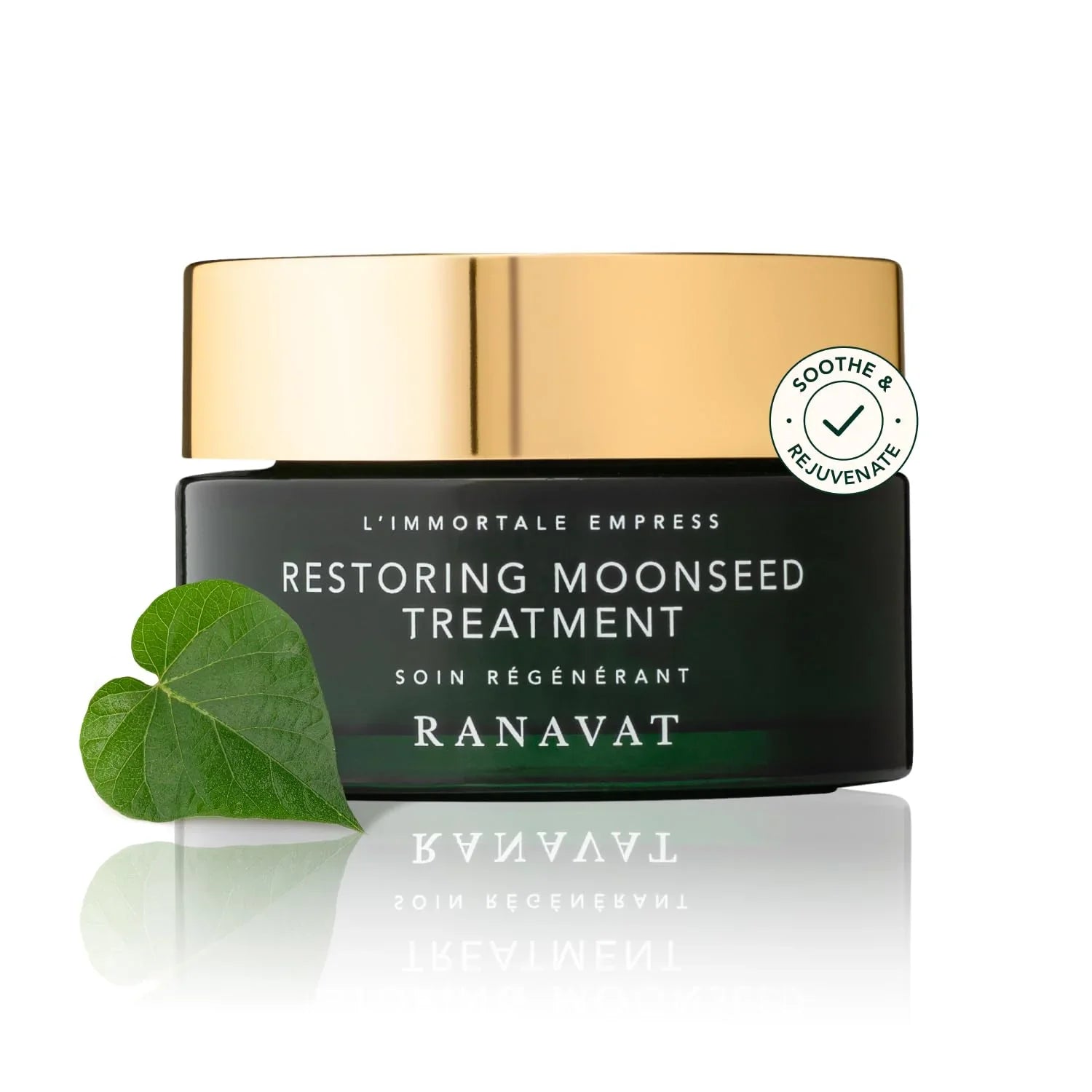 Ranavat Restoring Moonseed Treatment jar with gold lid and green leaf on white background